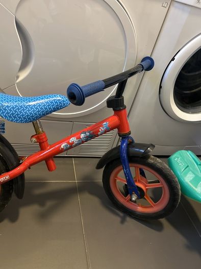 Two toddler bikes and a balance bike