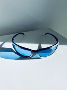 Vintage Arnette Titan 4006 sunglasses with blue lenses and sporty wraparound design