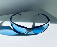 Vintage Arnette Titan 4006 sunglasses with blue lenses and sporty wraparound design