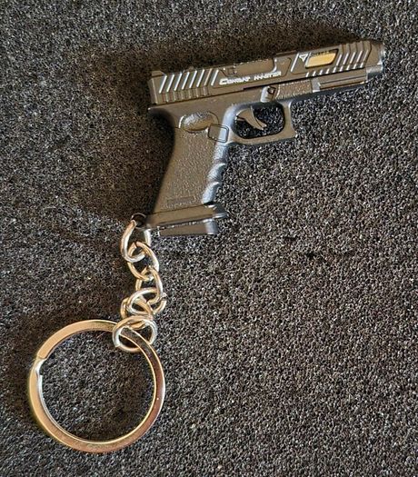 Keyring, firearms, luger. Nagant, glock, colt.