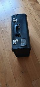 Black leather case. 19ins wide.14ins high. 4ins deep