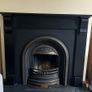 Beautiful cast iron fireplace with wood surround Image 2