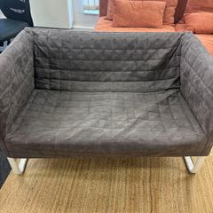 Grey quilted sofa with white metal frame