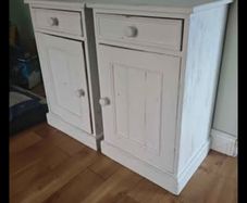 Matching pair of solid wood bedside lockers / cabinets.