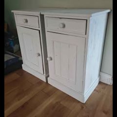 Matching pair of solid wood bedside lockers / cabinets.
