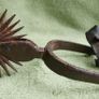 Antique handmade American wrought iron rider spores in western decor Americana rustic with original leather straps Image 2