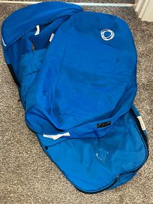 A blue bugaboo footmuff and apron
