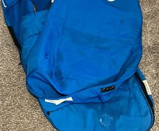 A blue bugaboo footmuff and apron
