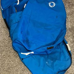 A blue bugaboo footmuff and apron