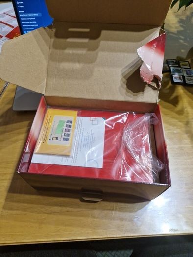 Nintendo 3DS Metallic Red with the original box, charger, and booklets