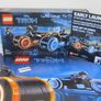 LEGO Ideas TRON Legacy Set 21314 Signed By Brick Bros UK With Poster And Signed Postcard And Rare Lego I Love London Tile Brick Leicester Square Signed By Designers BrickBros UK Pre 31st Release Early Launch And Also there is A Rare Blue Brick Lego Bag On Image 2