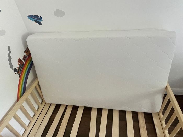 Gorgeous wooden toddler bed and brand new unused high quality mattress