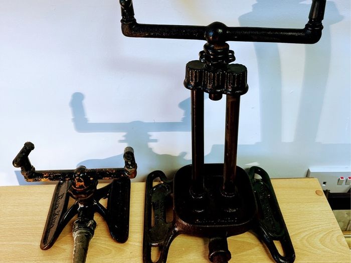 Two vintage rain king cast iron sprinklers