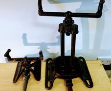 Two vintage rain king cast iron sprinklers