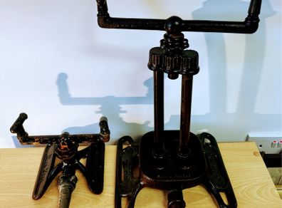 Two vintage rain king cast iron sprinklers