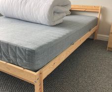 Light pine double bed and mattress from IKEA