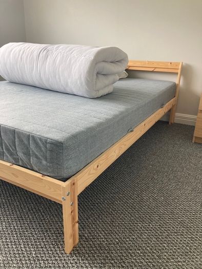 Light pine double bed and mattress from IKEA