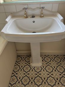 Traditional style brass bathroom taps and toilet flush handle