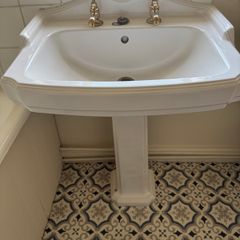 Traditional style brass bathroom taps and toilet flush handle