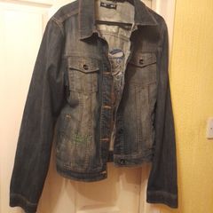 ED Hardy Denim Jacket.  More of a black/grey colour.  Fitted jacket.  Sleeves are long.  The decoration on the back is typical Ed Hardy