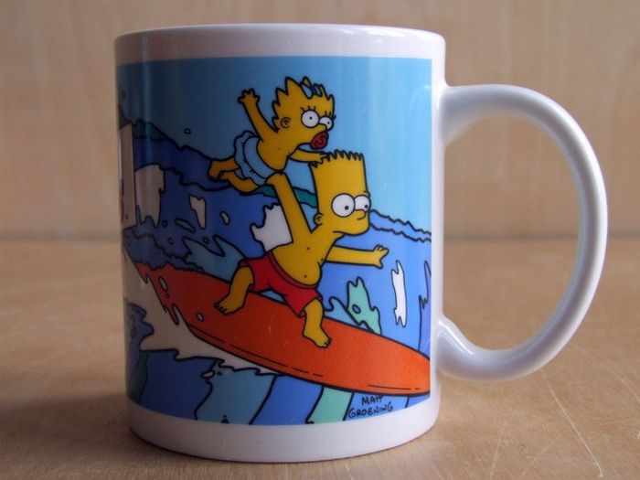 The Simpsons Bart and Maggie surfing mug
