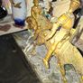 Rare Don Quixote and Sancho Panza cast in patinated bronze and mounted onto a veined marble plinth base. Don Quixote is depicted atop his gaunt horse, Rocinante, holding his shield, while his squire Sancho Panza follows Image 3
