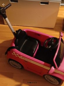 girls push along car