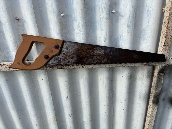 vintage wooden handled carpenters saw
