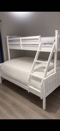 White wooden triple sleeper bunk bed