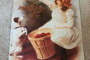 Vintage Style Metal Advertising Sign of a Girl with a Dog