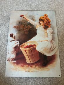 Vintage Style Metal Advertising Sign of a Girl with a Dog