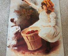 Vintage Style Metal Advertising Sign of a Girl with a Dog