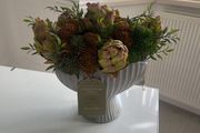Autumnal faux flower display in ceramic vase