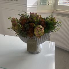 Autumnal faux flower display in ceramic vase