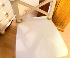 White wooden cross-back bar stool