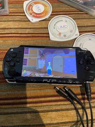 PSP  Console plus 10 games, charger and headphones