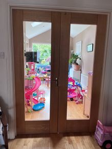 Solid wood internal double doors with clear glass panels