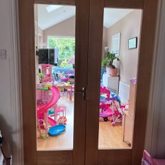 Solid wood internal double doors with clear glass panels