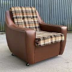 Vintage 1970s armchair on castors.