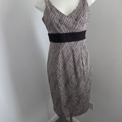 Never Worn. Size 12 Coast cream and black v-neck dress with gorgeous twist back detail.
