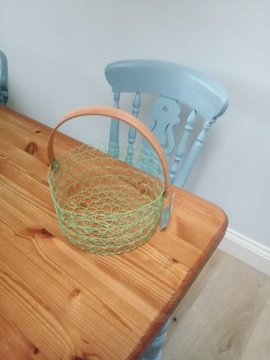New wire woven basket with wooden handle