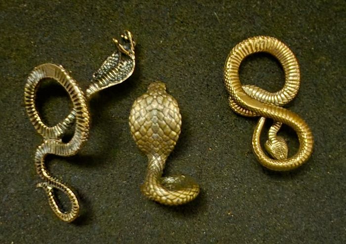 3 brass snakes.