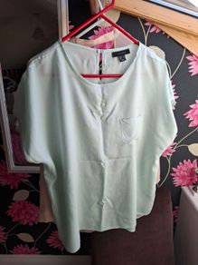 Mint green top.