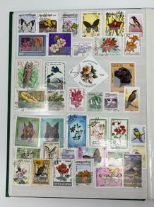 Collection. Green Lighthouse Stamp Stock book full of used stamps.  Over 600 stamps and a number of block. Good thematic of travel inc cars & animals