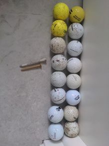 16 Golf balls and 2 tees