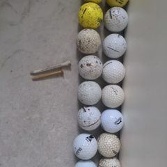 16 Golf balls and 2 tees