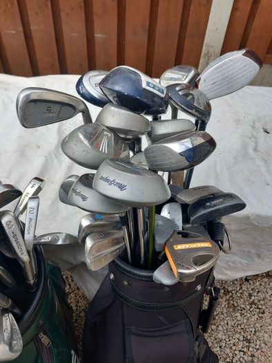 A selection of Golf clubs. Bags and golf balls.