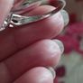 A 925 sterling silver ring with a floating diamond centerpiece. Image 9