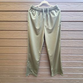 New FILA olive green athletic track pants with an elastic drawstring waistband and zippered ankle hems.