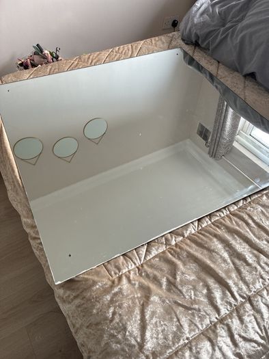 big rimless mirror that screw to wall. Have the 4 screws. In perfect condition. Box for transport